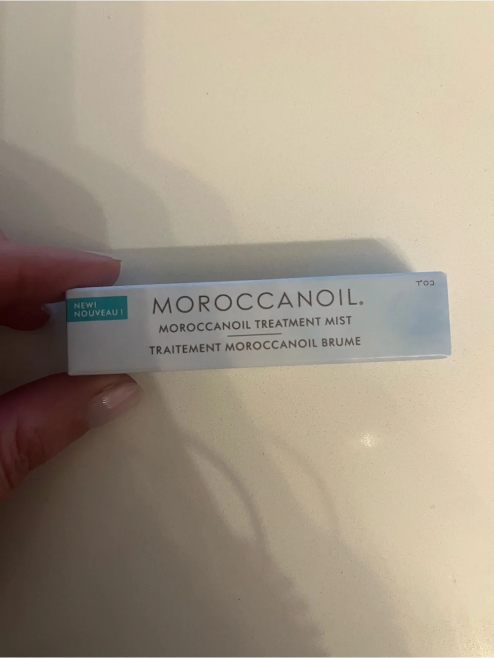 Moroccanoil Treatment Mist - White and Light Blue Packaging .17
